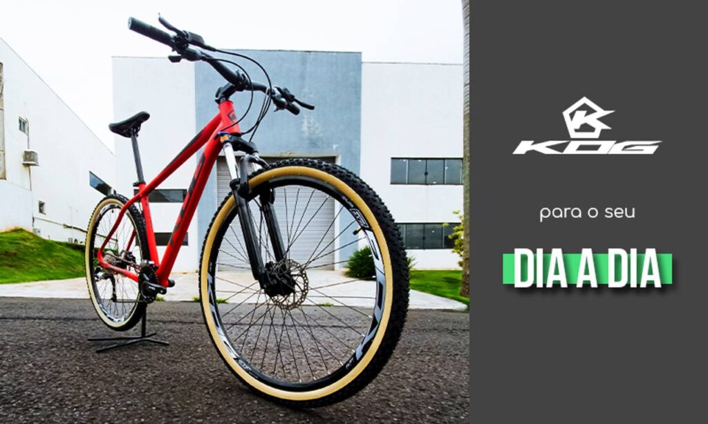 Biciclieta de cor preminante vermelha em asfalto, com escritas na imagem: kog para o seu dia a dia